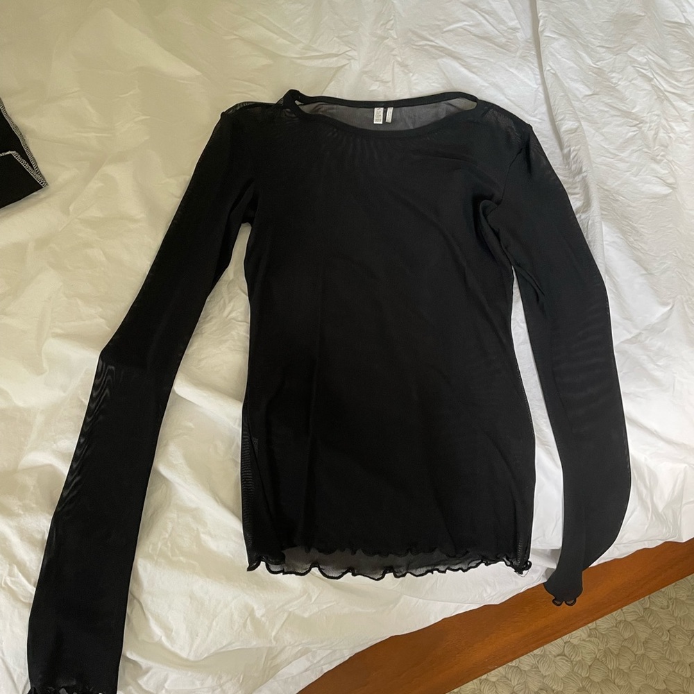 Sheer lettuce hem black top medium out from under